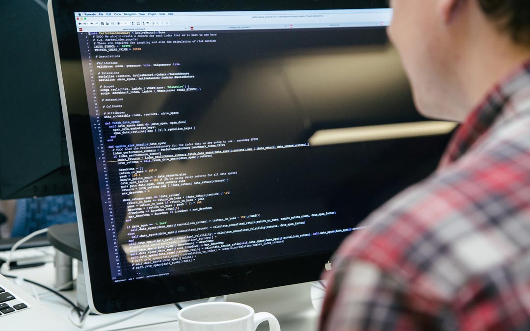 A software develops looks at lines of code