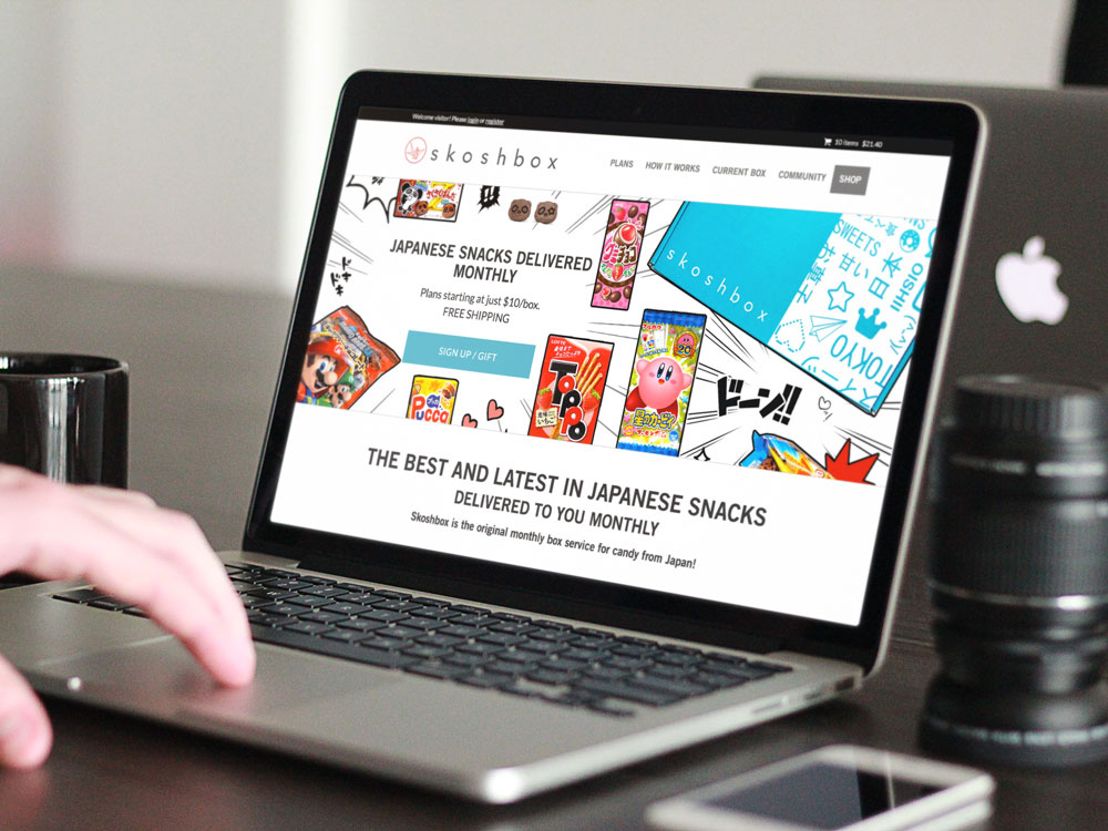 The Skoshbox homepage on a laptop